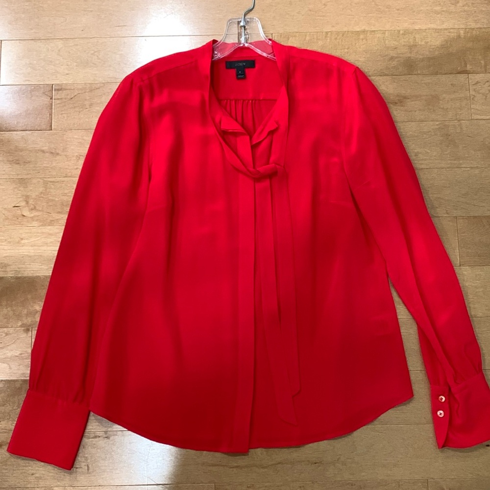 JCrew silk blouse. Tie in front. Pleats on sleeves. Warm red. Party or work wear